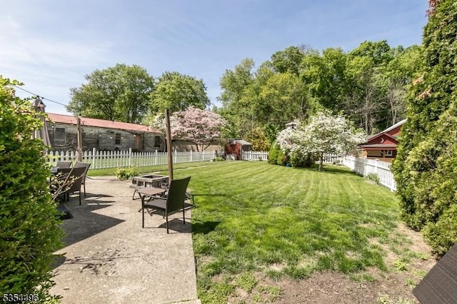 view of yard with a fenced backyard and a patio area