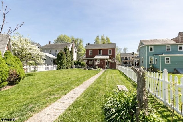 view of yard with a residential view and a fenced backyard