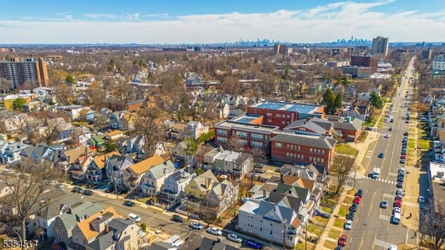 birds eye view of property with a view of city