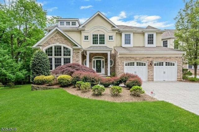 26 Avon Rd, Warren Twp, NJ 07059 - view of front of home featuring stone siding, stucco siding, a front yard, decorative driveway, and a garage