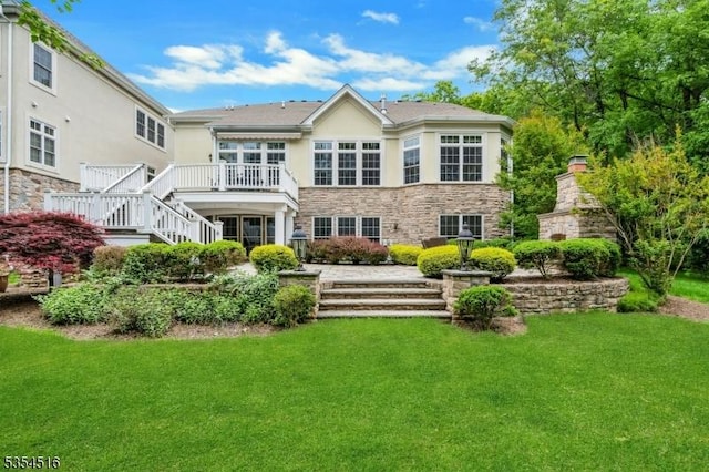 26 Avon Rd, Warren Twp, NJ 07059 - rear view of house featuring stairs, stone siding, a yard, and a deck