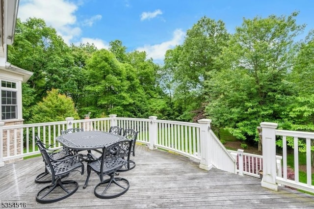 26 Avon Rd, Warren Twp, NJ 07059 - wooden deck with outdoor dining area and view of scattered trees