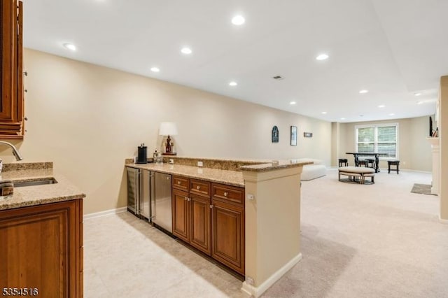 26 Avon Rd, Warren Twp, NJ 07059 - kitchen with a sink, light stone counters, fridge, recessed lighting, and a peninsula