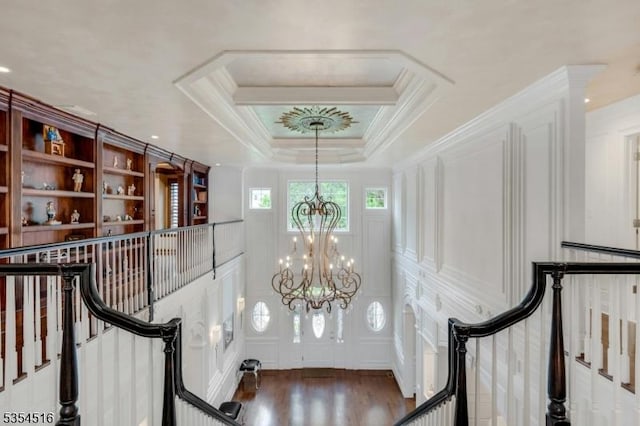 26 Avon Rd, Warren Twp, NJ 07059 - hall featuring a chandelier, a decorative wall, wood finished floors, ornamental molding, and stairs