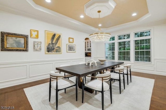 26 Avon Rd, Warren Twp, NJ 07059 - dining space with a tray ceiling, a decorative wall, wood finished floors, a chandelier, and crown molding