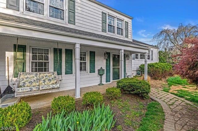 doorway to property featuring a porch