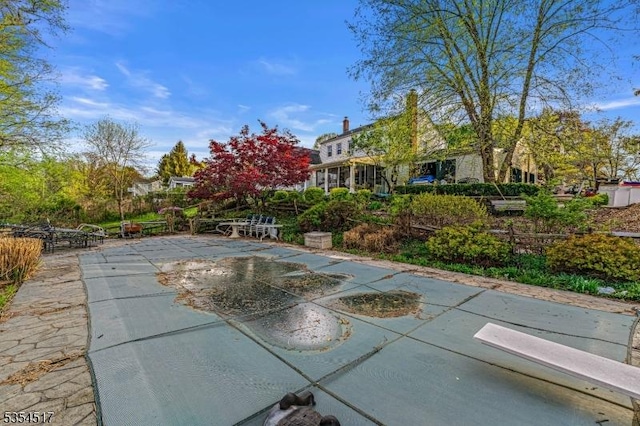 view of home's community featuring a patio area