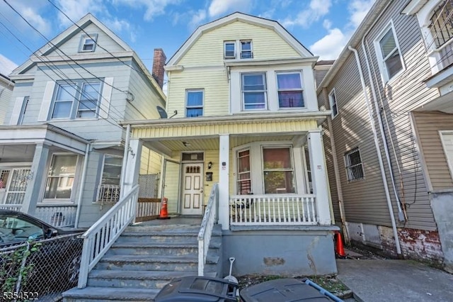 257 N 6th St, Newark City, NJ 07107 - view of front of property with a porch and a gambrel roof