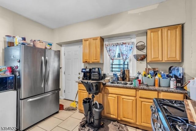 257 N 6th St, Newark City, NJ 07107 - kitchen featuring appliances with stainless steel finishes, light tile patterned floors, and a sink