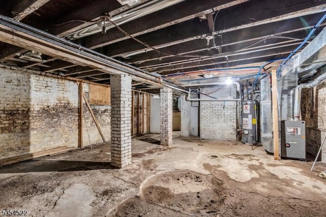 257 N 6th St, Newark City, NJ 07107 - unfinished below grade area with gas water heater and heating unit