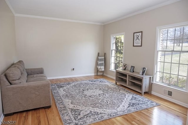 sitting room featuring plenty of natural light and light wood-style flooring