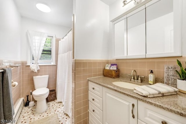 bathroom with toilet, tile walls, baseboard heating, and a wainscoted wall