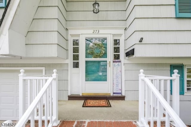 doorway to property featuring a garage