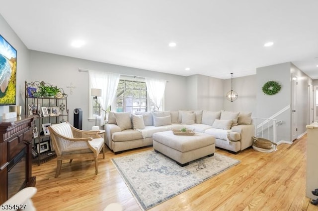 living room with recessed lighting and light wood finished floors