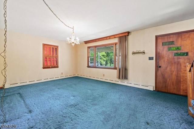 226 Wilson Rd, Franklin Twp, NJ 08873 - spare room featuring an inviting chandelier, a baseboard heating unit, and dark colored carpet