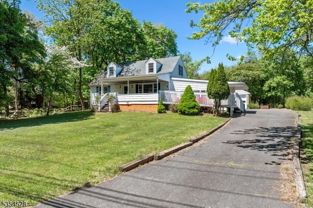 226 Wilson Rd, Franklin Twp, NJ 08873 - cape cod house featuring a porch and a front lawn
