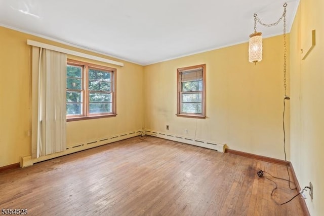 226 Wilson Rd, Franklin Twp, NJ 08873 - unfurnished room featuring baseboards, ornamental molding, baseboard heating, and hardwood / wood-style flooring