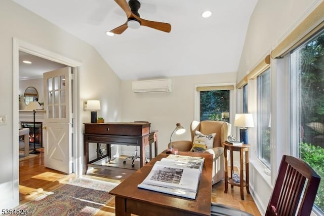 living area with a ceiling fan, a wall mounted AC, and lofted ceiling