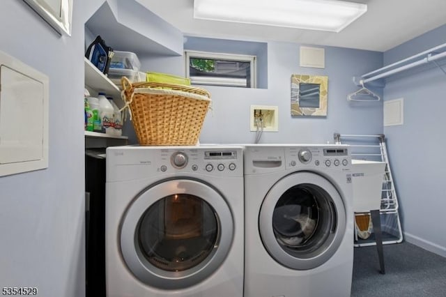 laundry area with carpet floors, baseboards, laundry area, and washer and clothes dryer