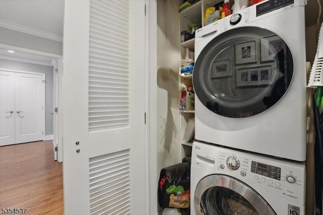 1125 Maxwell Ln Unit 908, Hoboken City, NJ 07030 - washroom featuring stacked washer / drying machine, crown molding, and wood finished floors