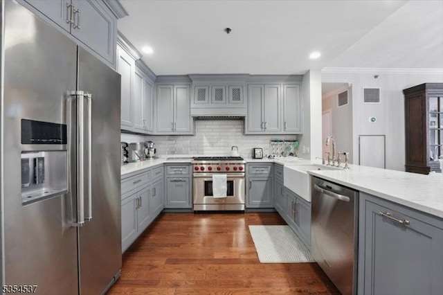 1125 Maxwell Ln Unit 908, Hoboken City, NJ 07030 - kitchen with premium appliances, gray cabinets, a sink, ornamental molding, and light countertops