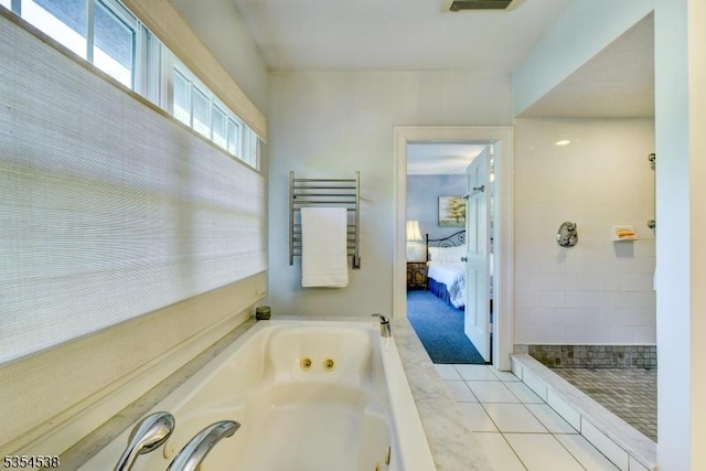 ensuite bathroom featuring tile patterned flooring, a tile shower, a tub with jets, radiator, and ensuite bathroom