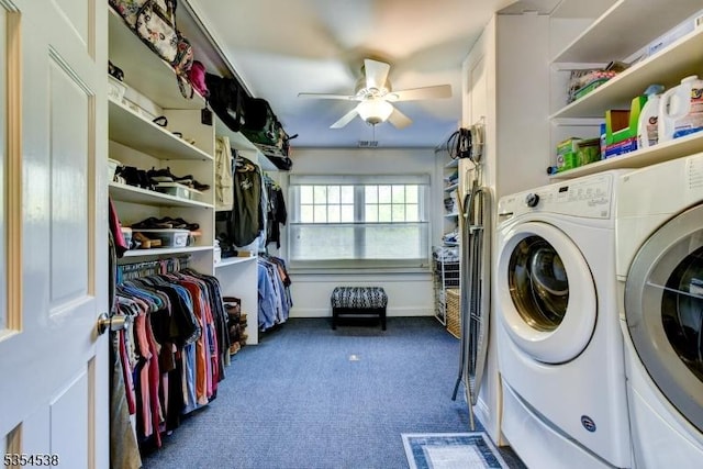laundry room with washing machine and clothes dryer, laundry area, ceiling fan, and dark colored carpet