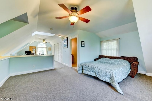 bedroom with baseboards, a ceiling fan, carpet, and lofted ceiling