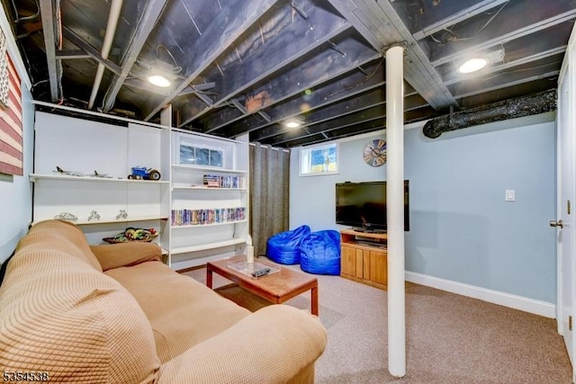 carpeted living room featuring baseboards