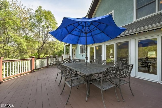 wooden deck with outdoor dining area