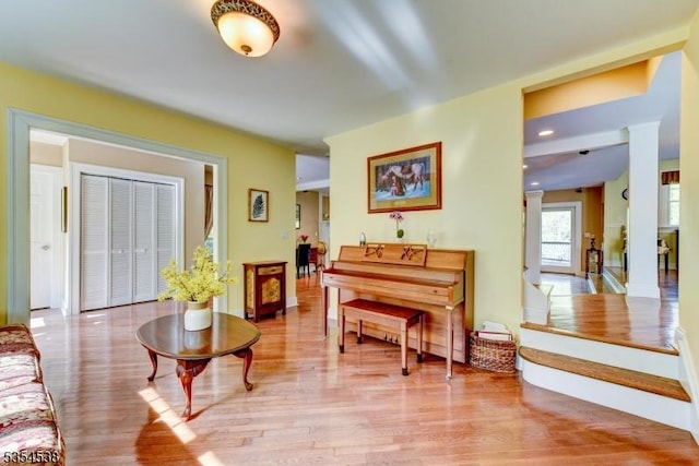 living area featuring baseboards and wood finished floors
