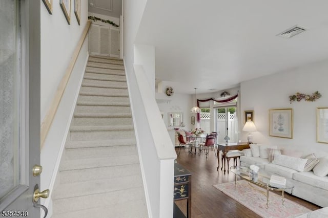 staircase with wood finished floors