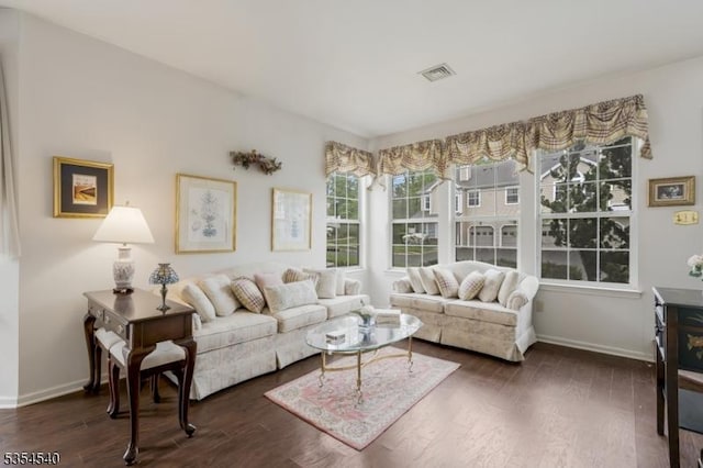 living room with dark wood-style floors and baseboards