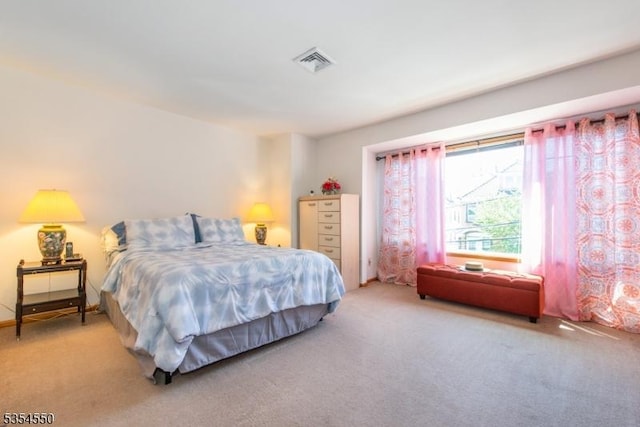 bedroom with carpet floors and visible vents
