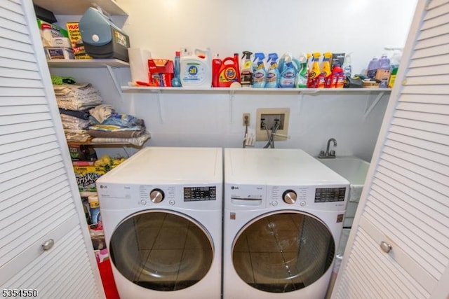 washroom with washer and dryer and laundry area