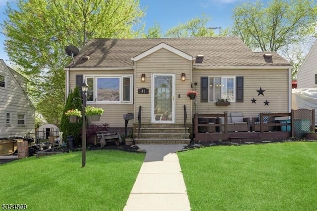 bungalow-style house with entry steps and a front yard