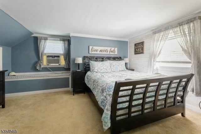 carpeted bedroom with baseboards, vaulted ceiling, and cooling unit