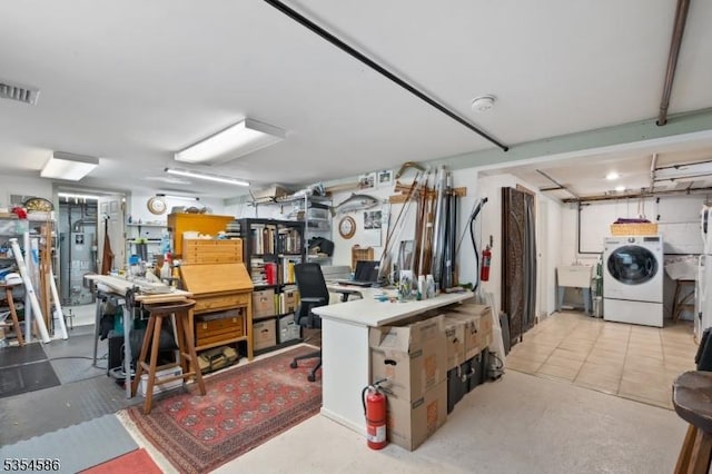 below grade area with visible vents and washer / dryer