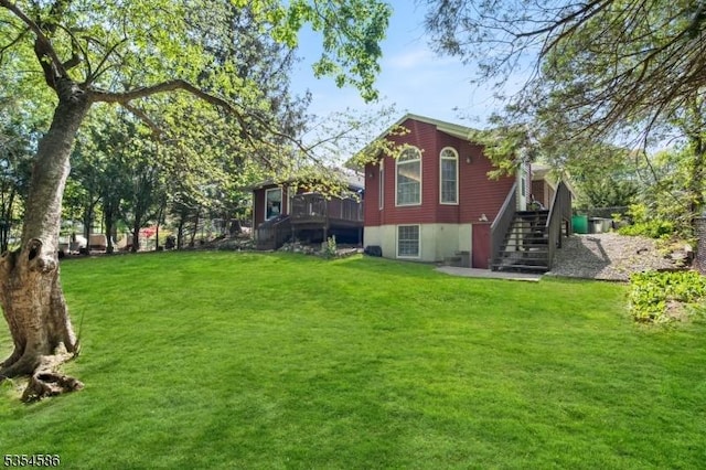 exterior space with a lawn and stairs