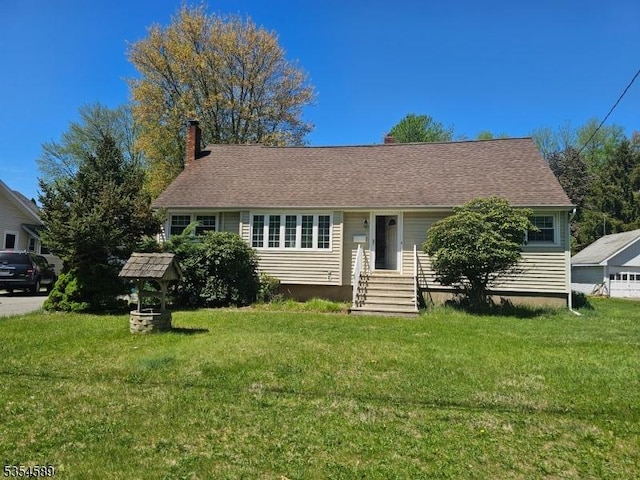 ranch-style home with entry steps, a chimney, and a front yard