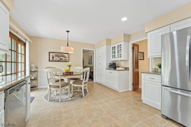 dining space featuring recessed lighting and baseboards