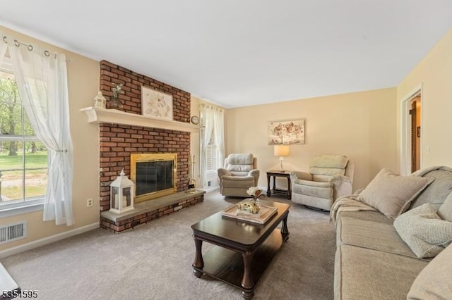 living area with carpet floors, baseboards, a brick fireplace, and visible vents