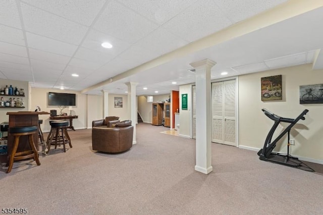 interior space with a dry bar, stairway, baseboards, carpet flooring, and recessed lighting