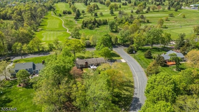birds eye view of property with golf course view