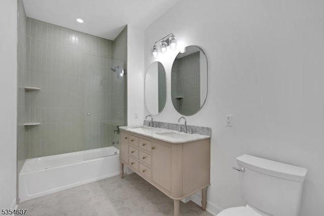 full bath featuring toilet, shower / washtub combination, and double vanity