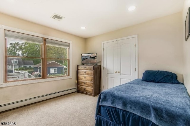 34 Hunter St, Roxbury Twp, NJ 07876 - carpeted bedroom with a baseboard heating unit and recessed lighting