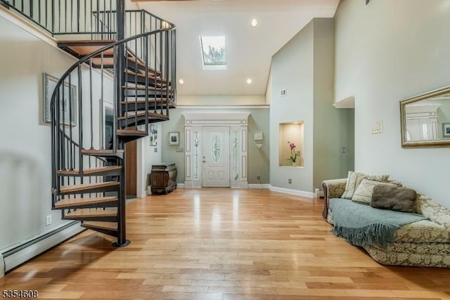 34 Hunter St, Roxbury Twp, NJ 07876 - foyer featuring a towering ceiling, stairway, wood finished floors, a baseboard radiator, and baseboards