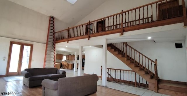 12 Ridge Rd, Andover Twp, NJ 07860 - living room featuring high vaulted ceiling, wood finished floors, and stairway