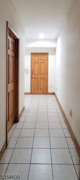 12 Ridge Rd, Andover Twp, NJ 07860 - corridor featuring light tile patterned flooring and baseboards