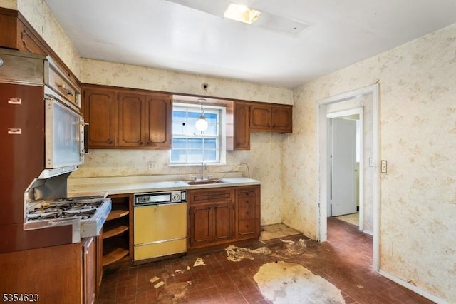630 Ridgewood Rd, Maplewood Twp, NJ 07040 - kitchen with white microwave, wallpapered walls, light countertops, a sink, and dishwasher